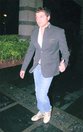 Known for his casual yet trendy look, Bollywood actor Bobby Deol makes a style statement in blue and black