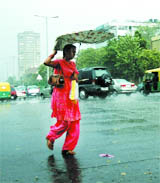 A girl caught in the rain in New Delhi 