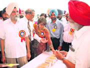 Dr S.S. Johl, eminent economist, having a word with farmers at the Kisan Mela on Thursday.