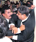Pakistani lawyers affiliated to different political parties scuffle during their protest in Multan on Thursday. Pakistan lawyers are demanding that judges deposed by former President Pervez Musharraf be reinstated to their previous postings and positions