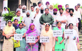 Members of the Rajiv Gandhi Panchayat Raj Sangathan protest against Ludhiana civil surgeon.