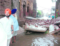 Heavy rain damaged part of the historical Sunami gate in Patiala on Friday.