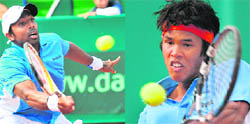 Prakash Amritraj (L) lunges forward to return against Victor Crivoi and Somdev Devvarman returns a ball to Victor Hanescu during their Davis Cup World Group Play-off matches against Romania in Bucharest 