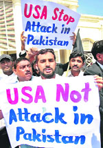 Lawyers hold placards as they gather to condemn strikes in Pakistani tribal areas along the Afghanistan border, during a protest in Multan on Friday.