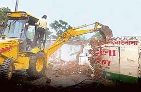 Structures being demolished at Jhota Kut Colony in Sector 71 of Mohali