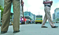 Delhi police personnel keep vigil at the spot where a bomb blast claimed two lives a week ago, in New Delhi on Saturday.