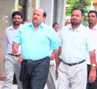 Tehsildar Arvind Parkash Verma (centre), arrested in a bribery case, being produced in a court by the Vigilance Bureau on Saturday. 