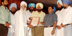 Deputy commissioner V.K. Meena honouring poets during the Baba Farid centenary celebrations in Faridkot on Sunday.