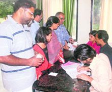 Voters standing at a polling station at Government College, Sector 46, Chandigarh 