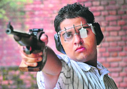 Shivendu Sharma aims at the target at the Sector 25 shooting range. 