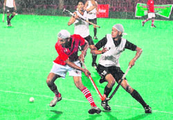 A match in progress between the Panjab State Electricity Board, Patiala, and Chandigarh Hockey Academy during the S.N. Vohras Gurmit Memorial Hockey Tournament at Sports Complex, Sector 42, Chandigarh, on Sunday. 