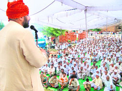 Ghirai MLA Prof Chhatarpal Singh addresses a mahapanchayat at Dhanan village in Bhiwani district on Sunday. 