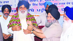 Chief Minister Parkash Singh Badal being presented a phulkari by the VC of Punjabi University Jaspal Singh in Patiala on Sunday.