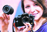 A model displays the 'Panasonic Lumix G1' one day before the opening of the Photokina 2008 World Fair for Imaging in Cologne