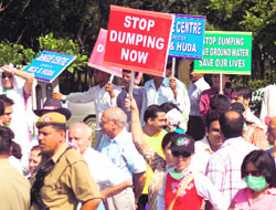 Residents of DLF (Phase 1) hold a protest against the illegal dumping of garbage in the area in Gurgaon 