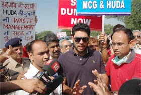 Yuvraj Singh interacts with the media during a protest rally against garbage dumping in Gurgaon on Monday.