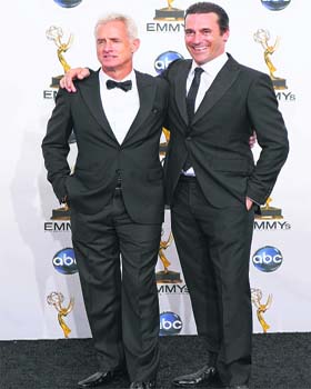 HANDSOME TWOSOME: Actors John Slattery (L) and Jon Hamm from Mad Men pose make a classic style statement in black.