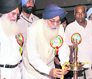 Chief Minister Parkash Singh Badal lights the lamp at the Baba Farid centenary celebrations at Faridkot on Monday.