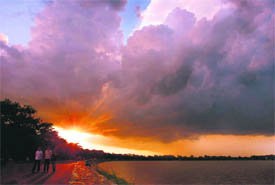 Monday evening saw the setting sun battle clouds at Sukhna Lake.