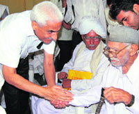 Deputy commissioner B.S. Malik greets freedom fighters at a function to mark Martyrs Day in Karnal on Tuesday.