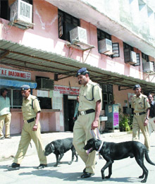 Bomb disposal squad personnel carry out a check at the Northern Railway headquarters, following a hoax bomb call, in New Delhi on Tuesday.