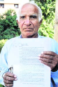 Shiv Nath at his Phase-X residence in Mohali