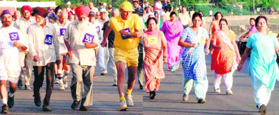 Senior citizens take part in the brisk walk competition organised by the Chandigarh Police in association with the Senior Citizen Association at Sukhna Lake on Thursday morning.