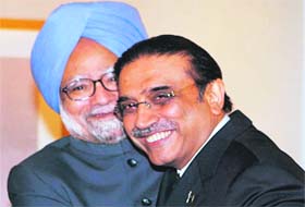 Prime Minister Manmohan Singh greets Pakistan President Asif Ali Zardari at a meeting in New York