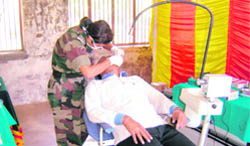 A doctor examines a patient during a medical camp at Rajinderpura village organised by the Armys Sunrise Brigade under Operation Sadbhavana