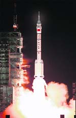 China Looks UP: The Long-March II-F rocket carrying the Shenzhou VII manned spacecraft blasts off from the Jiuquan Satellite Launch Center, Gansu province, on Thursday. China's third manned spacecraft blasted off from a remote launch site on a mission which is expected to include its first spacewalk