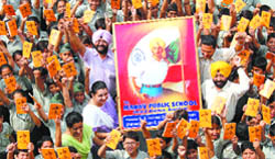 Students of Manav Public School carry the picture of Shaheed Bhagat SIngh in a special programme organised to mark the birth anniversary of the great martyr in Amritsar