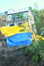 Living on edge: A house built almost on an edge fails to attract notice of the authorities.