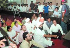 Independent councillor Joginder Singh Tony and opposition councillors stage a dharna against the mayor in the MC house in Jalandhar on Friday
