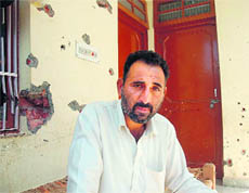Dejected Billu Ram outside his house damaged in the Chinore encounter.
