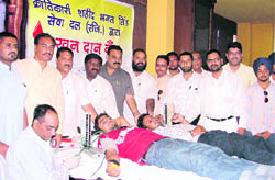 Members of the Krantikari Shaheed Bhagat Singh Sewa Dal donate blood at a camp in Ludhiana