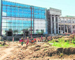 A shopping mall with three multiplexes coming up fast near the Dehra Dun ISBT.