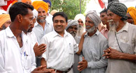 DIG Jitender Jain on Saturday with a group of those who were de-addicted in the village Behman Deewana near Bathinda where he launched a camp to motivate them to shun drugs.