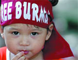 A child participates in a protest against the ruling Myanmar junta on the first anniversary of Saffron Revolution, in New Delhi
