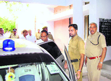 Judicial Magistrate (First Class) Chanderhaas leaves the Civil Lines police station in Rohtak after inspecting the lock-up where a Delhi youth died in police custody on Saturday.