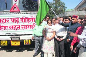 Chief Minister Prem Kumar Dhumal flags off a truck loaded with relief material for flood victims of Bihar