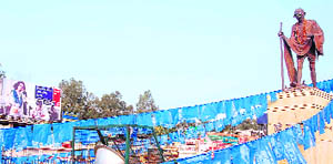 Polythene buntings of BSP rally around a statue of Mahatma Gandhi in Satwari Chowk in Jammu.