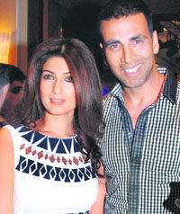 Bollywood actors Akshay Kumar and his wife Twinkle Khanna pose for a picture during a promotional event for a television channel in Mumbai
