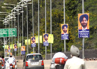 Posters of SAD chief Sukhbir Singh Badal installed on the illumination poles on Bathinda-Goniana road in Bathinda on Sunday.