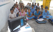 Students of the Government Primary School on Mall Road in Bathinda listen to educative programme on radio.