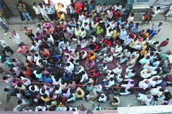 Residents and shopkeepers of Sarai Market at Mehrauli hold a dharna against the Saturday blast in New Delhi on Sunday. 