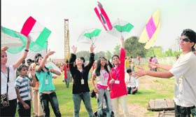 Girls fly kites on the second day of International Peace Festival at Gurukul School, Mani Majra, in Chandigarh