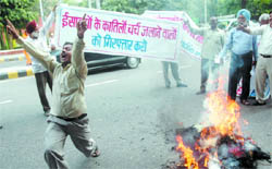 People protest against the RSS, Bajrang Dal and VHP during a campaign against atrocities on minorities, at Jantar Mantar in New Delhi