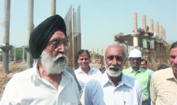 Union sports minister M.S. Gill reviews construction work of Talkatora swimming pool, which is being reconstructed for the 2010 Commonwealth Games in New Delhi