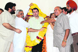 NC President Omar Abdullah is garlanded during a party rally in Jammu
