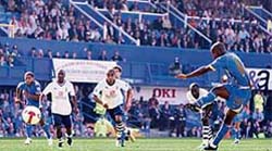 Portsmouths Jermain Defoe (R) scores his penalty against Tottenham during the game at Fratton Park in Portsmouth